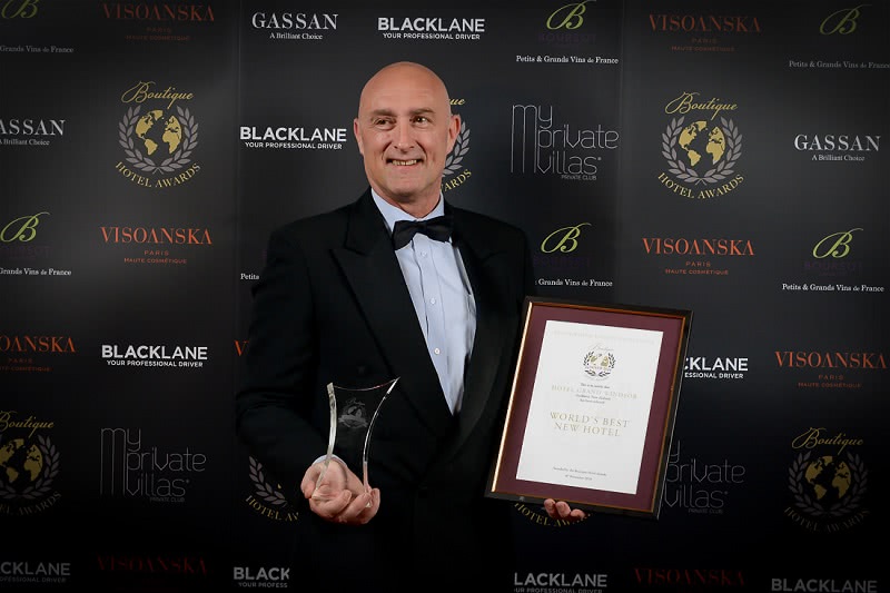Ronnie Ronalde, Group Operations Manager for CPG Hotels with the World's Best New Hotel Award