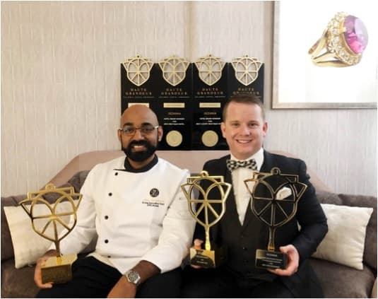 Hotel grand Windsor owners with trophies from Auckland accommodation awards